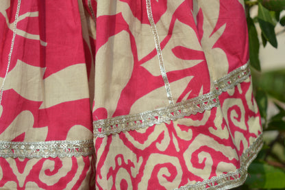 Red and beige patterned top and skirt