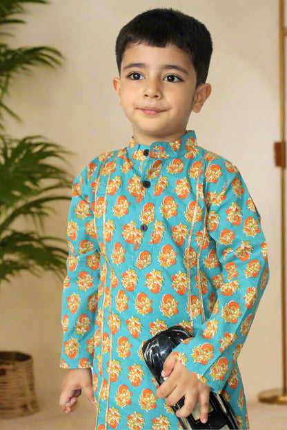 Child wearing a blue floral traditional outfit on a white background