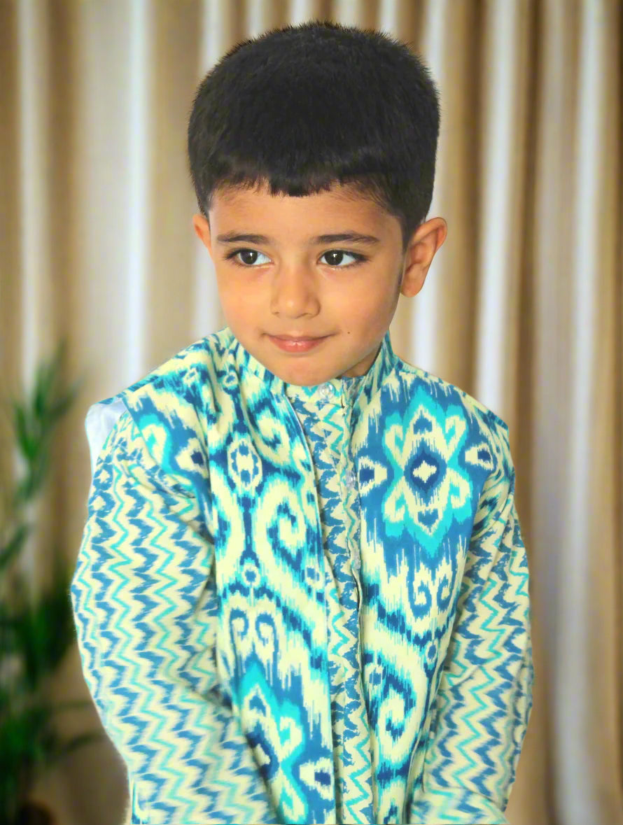 Child wearing a colorful patterned shirt against a brown background