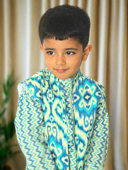 Child wearing a colorful patterned shirt against a brown background