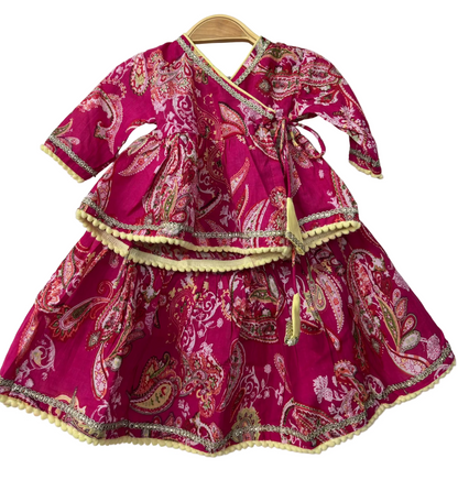Pink traditional outfit with paisley patterns 
