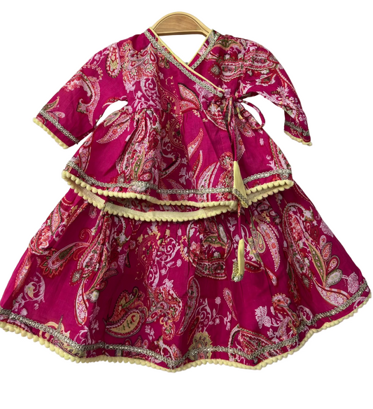 Pink traditional outfit with paisley patterns 